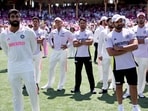 India's Jasprit Bumrah (L) reacts with teammates during the trophy ceremony after the fifth cricket Test match between Australia and India at The SCG in Sydney on January 5 India's Jasprit Bumrah (L) reacts with teammates during the trophy ceremony after the fifth cricket Test match between Australia and India at The SCG in Sydney on January 5