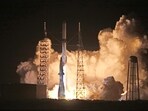 A Blue Origin New Glenn rocket lifts off (Photo by Gregg Newton / AFP)