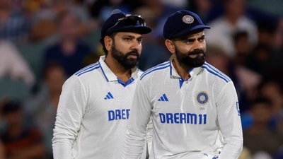 India's captain Rohit Sharma, left, looks on as teammate Virat Kohli rubs to shine the ball before passing it to the bowler (AP) India's captain Rohit Sharma, left, looks on as teammate Virat Kohli rubs to shine the ball before passing it to the bowler (AP)