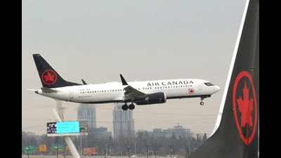An Air Canada Boeing 737 MAX 8 approaches for landing at Toronto Pearson International Airport over a parked Air Canada Boeing 737 MAX 8 aircraft in Toronto, Ontario, Canada, on March 13, 2019. (REUTERS) An Air Canada Boeing 737 MAX 8 approaches for landing at Toronto Pearson International Airport over a parked Air Canada Boeing 737 MAX 8 aircraft in Toronto, Ontario, Canada, on March 13, 2019. (REUTERS)