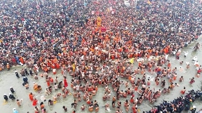 Flower petals being showered on devotees during the first ‘Amrit Snan’ at the Mahakumbh on Makar Sankranti, at Sangam in Prayagraj, Tuesday. (PTI Photo) (HT_PRINT) Flower petals being showered on devotees during the first ‘Amrit Snan’ at the Mahakumbh on Makar Sankranti, at Sangam in Prayagraj, Tuesday. (PTI Photo) (HT_PRINT)