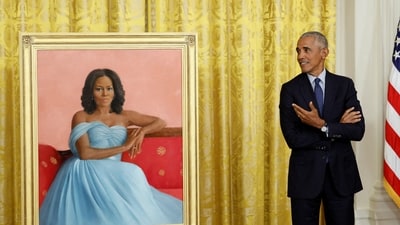 FILE PHOTO: Former U.S. President Barack Obama reacts as he stands next to former first lady Michelle Obama's official White House portrait, painted by Sharon Sprung, in the East Room of the White House. (REUTERS)