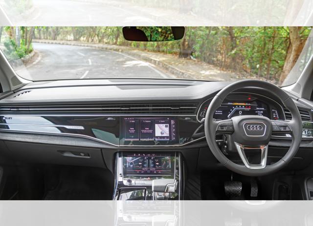 The dark, open-pore wood trims on the dashboard and doors add a modern touch. The dark, open-pore wood trims on the dashboard and doors add a modern touch.