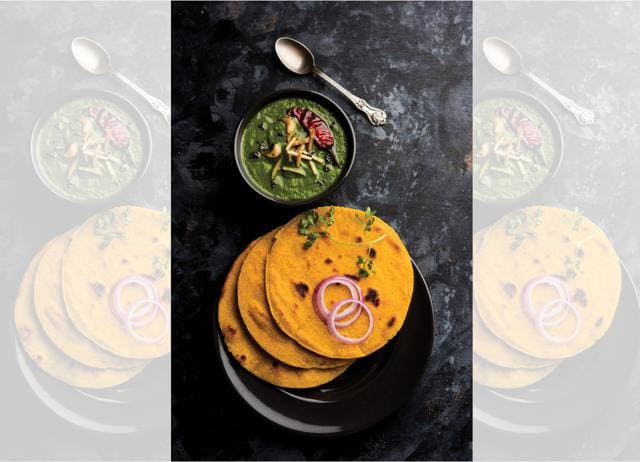 Sarson da saag with makki di roti is a Delhi winter staple. (ADOBE STOCK) Sarson da saag with makki di roti is a Delhi winter staple. (ADOBE STOCK)