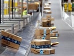 Amazon packages move along a conveyor at an Amazon warehouse facility, Dec. 17, 2019, in Goodyear, Ariz. Amazon packages move along a conveyor at an Amazon warehouse facility, Dec. 17, 2019, in Goodyear, Ariz.
