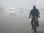 Commuters step out on a cold foggy morning amid rising air pollution. Commuters step out on a cold foggy morning amid rising air pollution.
