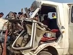 Pune: People gather near the wreckage of a vehicle at the site after a tempo hit a minivan, causing it to ram into a stationary bus on the Pune-Nashik Highway. Pune: People gather near the wreckage of a vehicle at the site after a tempo hit a minivan, causing it to ram into a stationary bus on the Pune-Nashik Highway.