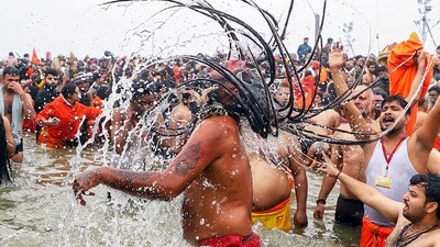Prayagraj, Jan 14 (ANI): Naga sadhus take 'Amrit Snan' at Triveni Sangam on the occasion of 'Makar Sankranti' during the Maha Kumbh 2025, in Prayagraj on Tuesday. (ANI Photo) (Naeem Ansari) Prayagraj, Jan 14 (ANI): Naga sadhus take 'Amrit Snan' at Triveni Sangam on the occasion of 'Makar Sankranti' during the Maha Kumbh 2025, in Prayagraj on Tuesday. (ANI Photo) (Naeem Ansari)