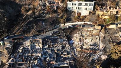 An aerial view of hillside homes destroyed as wildfires cause damage and loss through the LA region (Getty Images via AFP)