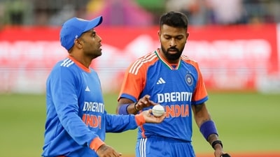 India's Suryakumar Yadav (L) hands the ball to India's Hardik Pandya (R) during the second T20 international cricket match between South Africa and India at St Georges Park in Gqeberha on November 10, 2024. (Photo by PHILL MAGAKOE / AFP) (AFP) India's Suryakumar Yadav (L) hands the ball to India's Hardik Pandya (R) during the second T20 international cricket match between South Africa and India at St Georges Park in Gqeberha on November 10, 2024. (Photo by PHILL MAGAKOE / AFP) (AFP)