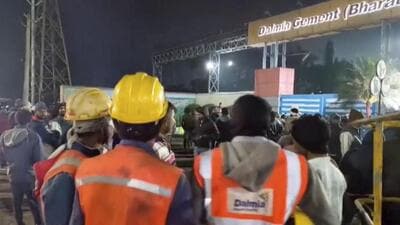 People gather outside the Dalmia Cement factory after an incident of hopper collapse. (PTI photo) People gather outside the Dalmia Cement factory after an incident of hopper collapse. (PTI photo)