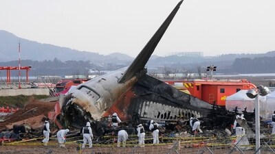 Rescue team members work at the site of a plane crash at Muan International Airport in South Korea. (AP File Photo) Rescue team members work at the site of a plane crash at Muan International Airport in South Korea. (AP File Photo)