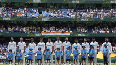 The Indian team stand for their national anthem ahead of play on the first day of the fourth cricket Test against Australia at MCG. (AP) The Indian team stand for their national anthem ahead of play on the first day of the fourth cricket Test against Australia at MCG. (AP)