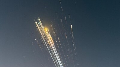 Debris falls after Elon Musk's Starship prototype breaks in space (AFP) Debris falls after Elon Musk's Starship prototype breaks in space (AFP)