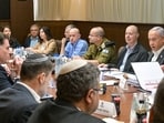 This handout picture released by the Israeli Government Press Office (GPO) shows Prime Minister Benjamin Netanyahu (2-R), heading a security cabinet meeting to vote on a Gaza ceasefire and hostage release deal that should take effect ton January 19, in Jerusalem on January 17, 2025. This handout picture released by the Israeli Government Press Office (GPO) shows Prime Minister Benjamin Netanyahu (2-R), heading a security cabinet meeting to vote on a Gaza ceasefire and hostage release deal that should take effect ton January 19, in Jerusalem on January 17, 2025.