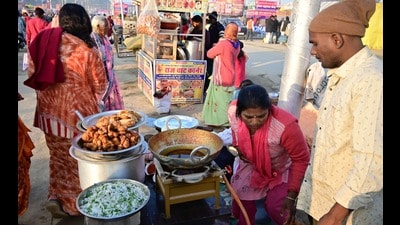 Abhay Sharma from Ghazipur selling the eastern UP dish of ‘Bati-Chokha’ in the Mela area on Saturday. (Anil Kumar Maurya/HT) Abhay Sharma from Ghazipur selling the eastern UP dish of ‘Bati-Chokha’ in the Mela area on Saturday. (Anil Kumar Maurya/HT)