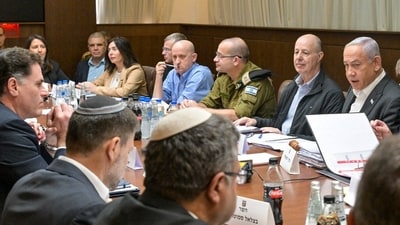 This handout picture released by the Israeli Government Press Office (GPO) shows Prime Minister Benjamin Netanyahu (2-R), heading a security cabinet meeting to vote on a Gaza ceasefire and hostage release deal that should take effect ton January 19, in Jerusalem on January 17, 2025. (AFP) This handout picture released by the Israeli Government Press Office (GPO) shows Prime Minister Benjamin Netanyahu (2-R), heading a security cabinet meeting to vote on a Gaza ceasefire and hostage release deal that should take effect ton January 19, in Jerusalem on January 17, 2025. (AFP)