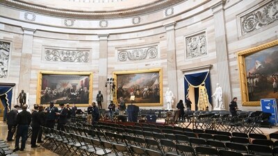 The US Capitol Rotunda is prepared for the inauguration of US President-elect Donald Trump in Washington, DC. Trump said that his inauguration as US president on January 20 will be moved indoors due to expected freezing weather. Trump said he will deliver his inaugural address in the Rotunda of the US Capitol. (Photo by SAUL LOEB / AFP) (AFP) The US Capitol Rotunda is prepared for the inauguration of US President-elect Donald Trump in Washington, DC. Trump said that his inauguration as US president on January 20 will be moved indoors due to expected freezing weather. Trump said he will deliver his inaugural address in the Rotunda of the US Capitol. (Photo by SAUL LOEB / AFP) (AFP)