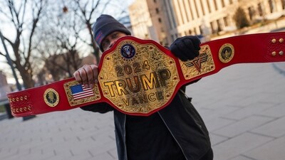 U.S. President-elect Donald Trump's supporter poses for photos with a "championship belt", ahead of the presidential inauguration in Washington. (REUTERS)