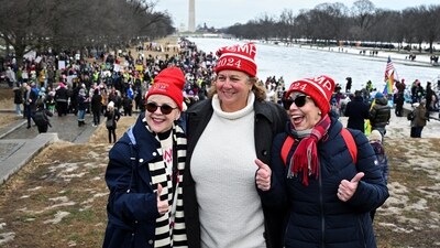 Supporters of US President-elect Donald Trump pose for a photo near the Lincoln Memorial, ahead of Trump's presidential inauguration, in Washington. (REUTERS)
