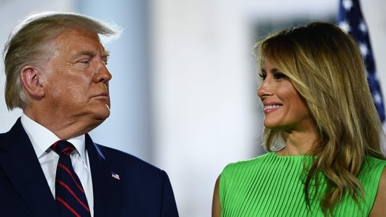 (FILES) US First Lady Melania Trump smiles to US President Donald Trump atthe conclusion of the final day of the Republican National Convention from the South Lawn of the White House on August 27, 2020 in Washington, DC. (Photo by Brendan Smialowski / AFP) (AFP)