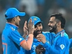 Virat Kohli (2R) celebrates with Shubman Gill (L), captain Rohit Sharma (2L) after taking a wicket. Virat Kohli (2R) celebrates with Shubman Gill (L), captain Rohit Sharma (2L) after taking a wicket.