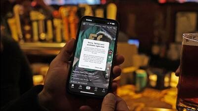 A TikTok user holds a phone showing the screen of the social media app in Washington, DC, on Sunday. (AFP) A TikTok user holds a phone showing the screen of the social media app in Washington, DC, on Sunday. (AFP)