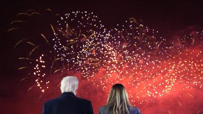 Donald Trump and his wife Melania watch fireworks during a reception at Trump National Golf Club on Sunday. (AFP) Donald Trump and his wife Melania watch fireworks during a reception at Trump National Golf Club on Sunday. (AFP)