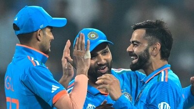 Virat Kohli (2R) celebrates with Shubman Gill (L), captain Rohit Sharma (2L) after taking a wicket. (AFP) Virat Kohli (2R) celebrates with Shubman Gill (L), captain Rohit Sharma (2L) after taking a wicket. (AFP)