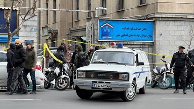 Members of the police stand in front of the judiciary building after the assassination of the Supreme Court Judges Mohammad Moghiseh and Ali Razini in Tehran, Iran, January 18, 2025. (via REUTERS)