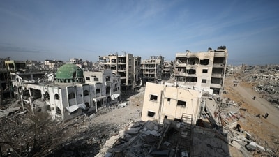 Displaced Palestinians walk past the rubble as they attempt to return to their homes, following a delay in the ceasefire between Israel and Hamas over the hostage list, in the northern Gaza Strip, January 19, 2025.&nbsp; (REUTERS)