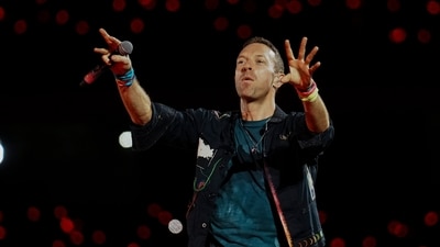 British band Coldplay's Chris Martin performs during the bands Music Of The Spheres World Tour Produced and Promoted By BookMyShow Live, at the D Y Patil Sports Stadium, in Navi Mumbai, Saturday. (PTI) British band Coldplay's Chris Martin performs during the bands Music Of The Spheres World Tour Produced and Promoted By BookMyShow Live, at the D Y Patil Sports Stadium, in Navi Mumbai, Saturday. (PTI)
