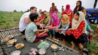 Rahul Gandhi sporting his trademark white t-shirt while meeting farmers (PTI/File Photo) Rahul Gandhi sporting his trademark white t-shirt while meeting farmers (PTI/File Photo)