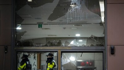 Police officers patrol inside Seoul Western District Court after supporters of impeached South Korean President Yoon Suk Yeol broke into the court in Seoul, South Korea, Sunday, Jan. 19, 2025. (AP)