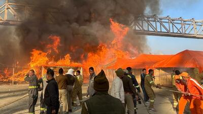 The fire broke out in Sector 19 of the sprawling 4,000-hectare tent city on the banks of Sangam with plumes of smoke emerging from the burning camp. (PTI)