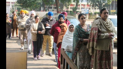 Voters wait to cast their votes during Haryana Sikh Gurdwaras Management Committee elections in Gurugram on Sunday. (PTI) Voters wait to cast their votes during Haryana Sikh Gurdwaras Management Committee elections in Gurugram on Sunday. (PTI)