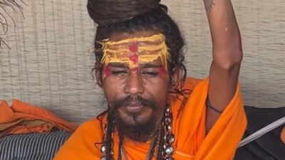 This sadhu (saint) sitting in his tent at the Mahakumbh Mela in Prayagraj went viral for hitting a reporter with his tongs. While being questioned, the sadhu was seemingly irritated by the questions. Soon, he got up, struck the reporter and pushed him out of his tent. (Instagram/janta_darbaar123) This sadhu (saint) sitting in his tent at the Mahakumbh Mela in Prayagraj went viral for hitting a reporter with his tongs. While being questioned, the sadhu was seemingly irritated by the questions. Soon, he got up, struck the reporter and pushed him out of his tent. (Instagram/janta_darbaar123)