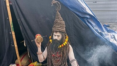 Panchayati Niranjani Akhara's Digambar Ajay Giri, popularly known as Rudraksh Baba, wears 108 rudraksh garlands consisting of 11,000 rudraksh. The weight of these Rudrakshas is more than 30 kilograms. Several devotees and social media influencers have been drawn towards the baba to take pictures and videos of him. (ANI) Panchayati Niranjani Akhara's Digambar Ajay Giri, popularly known as Rudraksh Baba, wears 108 rudraksh garlands consisting of 11,000 rudraksh. The weight of these Rudrakshas is more than 30 kilograms. Several devotees and social media influencers have been drawn towards the baba to take pictures and videos of him. (ANI)
