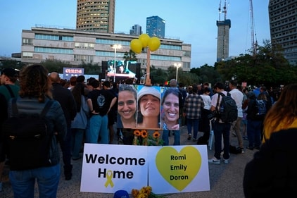 Supporters and relatives of hostages held captive in the Gaza Strip react while watching a live television broadcast on the release of Israeli hostages, at the Hostages Square in Tel Aviv, on January 19, 2025. (AFP) Supporters and relatives of hostages held captive in the Gaza Strip react while watching a live television broadcast on the release of Israeli hostages, at the Hostages Square in Tel Aviv, on January 19, 2025. (AFP)