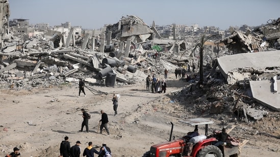 Displaced Palestinians walk past the rubble as they attempt to return to their homes, following a delay in the ceasefire between Israel and Hamas over the hostage list, in the northern Gaza Strip, January 19, 2025.&nbsp;(REUTERS)