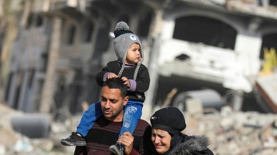 Displaced Palestinians walk past the rubble as they attempt to return to their homes, following a delay in the ceasefire between Israel and Hamas over the hostage list, in the northern Gaza Strip, January 19, 2025.&nbsp;(REUTERS)