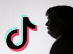 A 3D-printed miniature model of US President-elect Donald Trump and TikTok logo are seen in this illustration taken January 19, 2025.