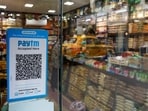 Paytm Q3 2025 results: A QR code sticker of the digital payment app Paytm is seen outside a grocery store in Kolkata, India.