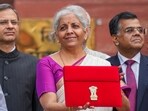 Union Finance Minister Nirmala Sitharaman displays a red pouch carrying the Budget documents outside the Finance Ministry in North Block before leaving for the Parliament where she will table the Union Budget 2024-25, in New Delhi, (File image) Union Finance Minister Nirmala Sitharaman displays a red pouch carrying the Budget documents outside the Finance Ministry in North Block before leaving for the Parliament where she will table the Union Budget 2024-25, in New Delhi, (File image)