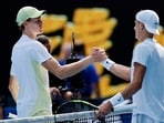 Italy's Jannik Sinner shakes hands with Denmark's Holger Rune after winning his fourth round match 