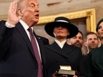Donald Trump takes the oath of office as his wife Melania and his children look on during inauguration ceremonies in the Rotunda of the U.S. Capitol on January 20, 2025 in Washington, 