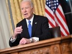 US President Joe Biden gestures as he delivers his farewell address to the nation from the Oval Office of the White House in Washington, DC. US President Joe Biden gestures as he delivers his farewell address to the nation from the Oval Office of the White House in Washington, DC.