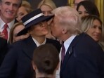 Donald Trump and Melania Trump shared a awkward moment as they kissed at the inauguration day.