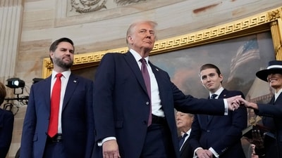 US President Donald Trump, center, holds the hand of his wife Melania Trump. (AP) US President Donald Trump, center, holds the hand of his wife Melania Trump. (AP)