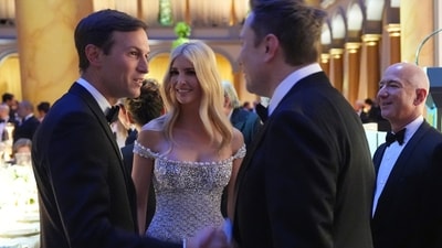 Elon Musk shakes hands with Jared Kushner as Ivanka Trump and Jeff Bezos watch, before Donald Trump speaks at a dinner at the Building Museum. (AP) Elon Musk shakes hands with Jared Kushner as Ivanka Trump and Jeff Bezos watch, before Donald Trump speaks at a dinner at the Building Museum. (AP)